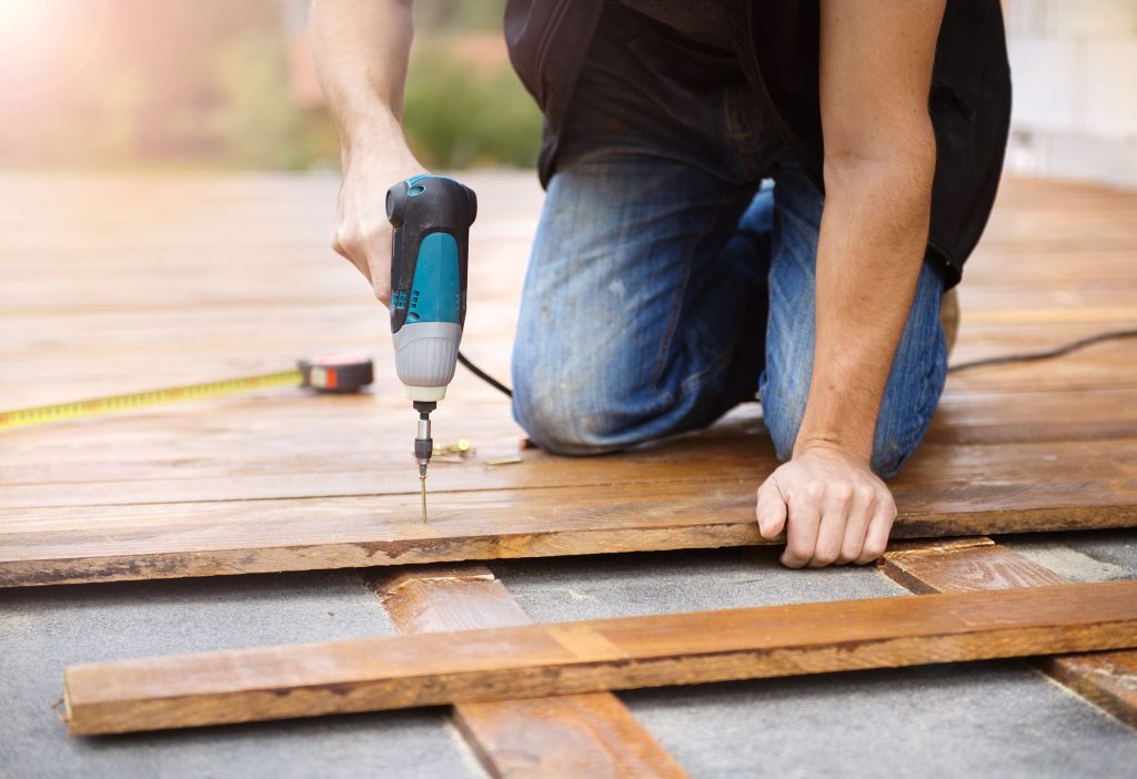 handyman installing wooden flooring 2026 03 10 03 07 29 utc1 Deck Building Services in Stanwood, WA | Builders