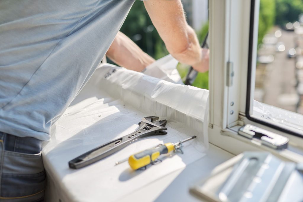 installing an air conditioner in an apartment offi 2026 03 17 14 48 49 utc1 Window Services in Stanwood, WA | Installation Pros