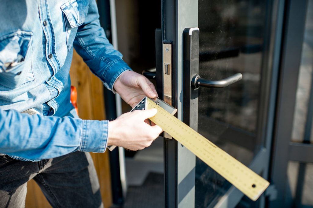 man changing core of a door lock 2026 03 24 07 40 21 utc1 Door Installation & Replacement in Stanwood, WA
