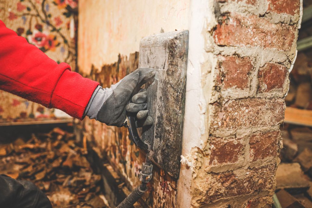 hands of a young caucasian guy removes retro wallp 2026 01 08 06 26 24 utc1 Rot Repair Services in Stanwood, WA | Experts